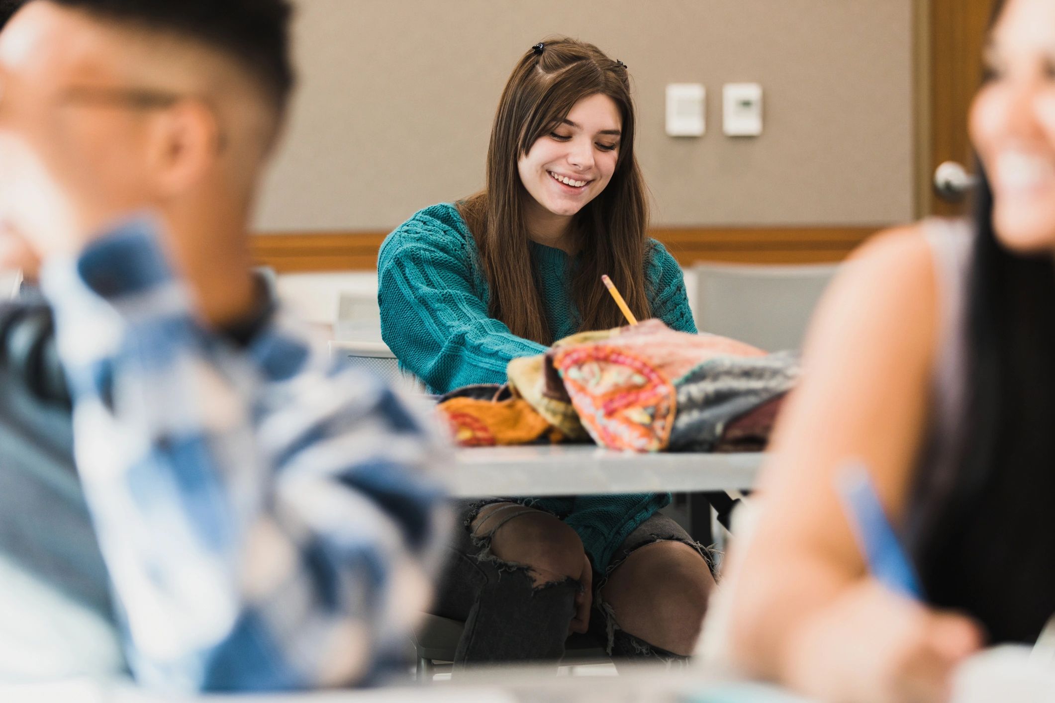 Student smiling in a classroom